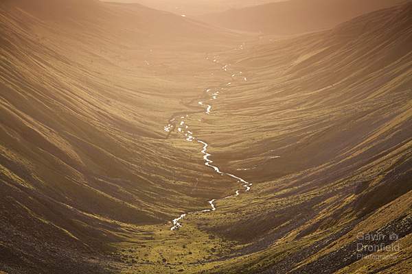 high cupgill beck meandering down u-shaped high cup gill valley from high cup nick during golden winter sunset