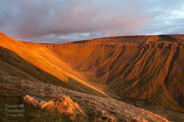 high cup nick golden sunset and the high cup gill valley seen from the pennine way path