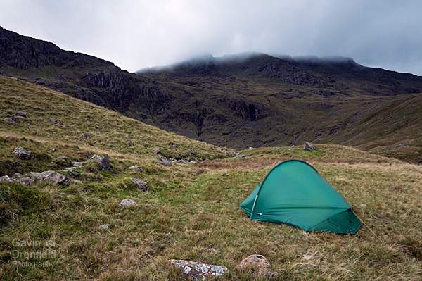 terra nova competition tent pitched near angle tarn under cloud covered esk pike