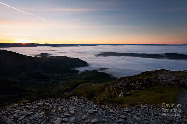sunrise from old man of coniston looking down to coppermines valley and a cloud inversion