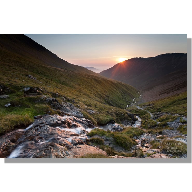 Atmospheric sunset over Liza Beck tumbling down Gasgale Gill from Coledale Hause