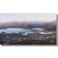Autumnal dawn mists over Keswick and Derwent Water from Latrigg