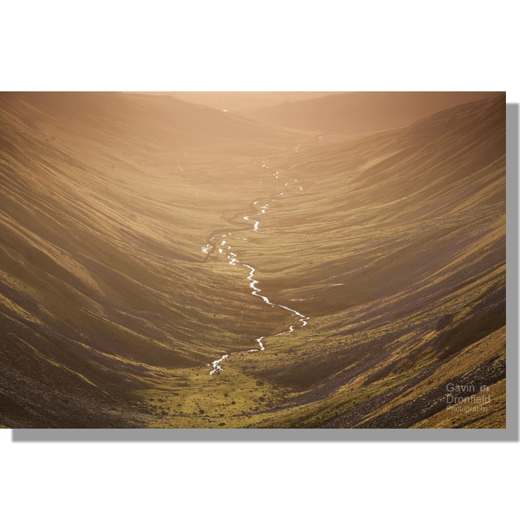 high cupgill beck meandering down u-shaped high cup gill valley from high cup nick during golden winter sunset